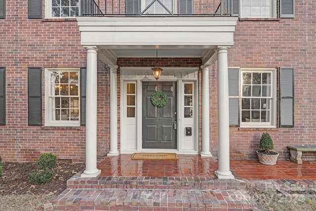 entrance to property featuring a balcony