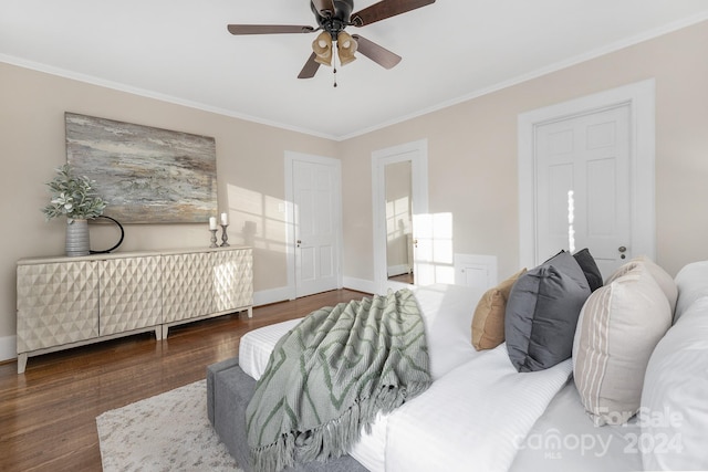 bedroom featuring ceiling fan, crown molding, and dark hardwood / wood-style flooring