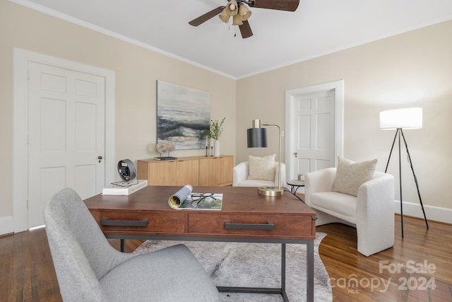 home office featuring dark wood-type flooring, ceiling fan, and crown molding