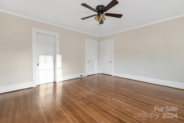 empty room with hardwood / wood-style floors, ceiling fan, and ornamental molding