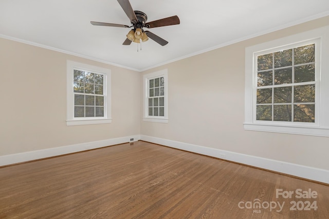 spare room with ornamental molding, hardwood / wood-style floors, and ceiling fan