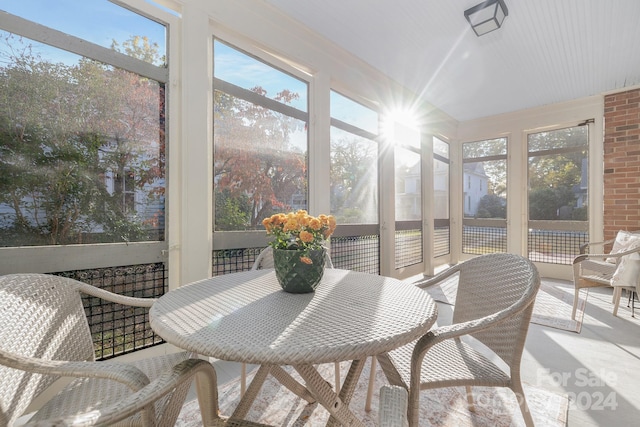 sunroom / solarium featuring a mountain view