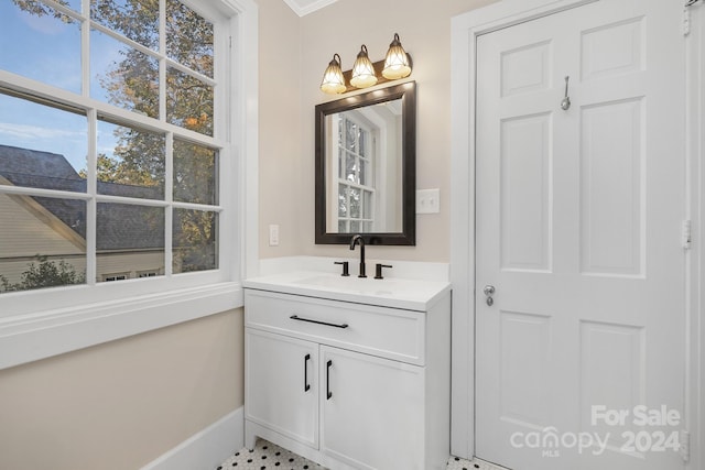 bathroom featuring vanity and crown molding