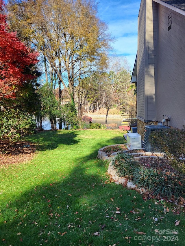 view of yard featuring central AC