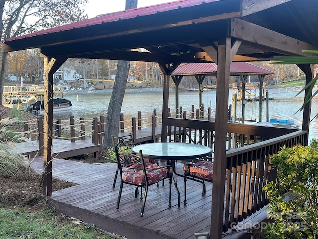 dock area with a water view and boat lift