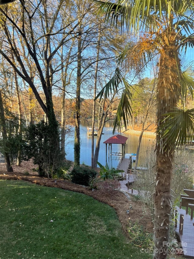 exterior space with a lawn and a water view