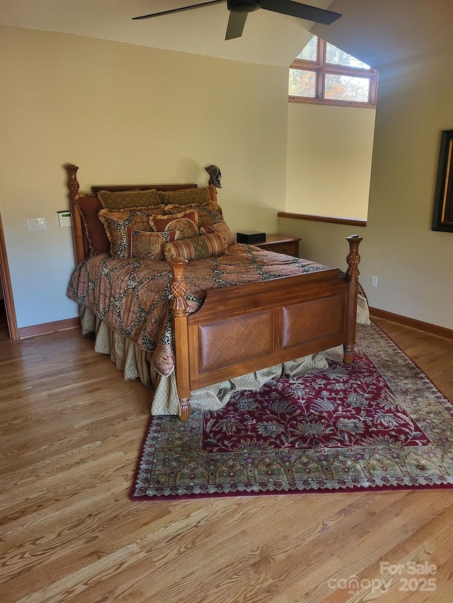 bedroom with baseboards, a ceiling fan, and wood finished floors