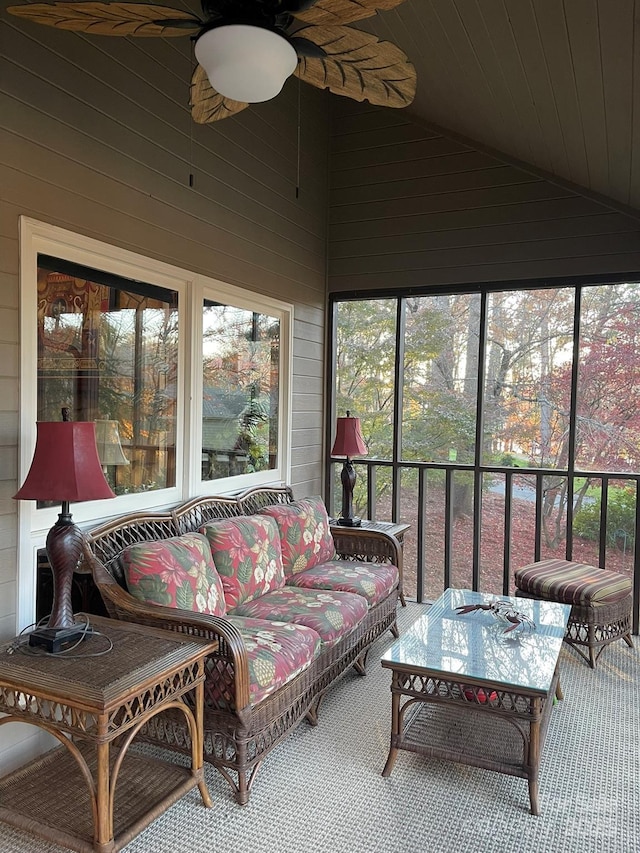 sunroom / solarium featuring vaulted ceiling and a ceiling fan