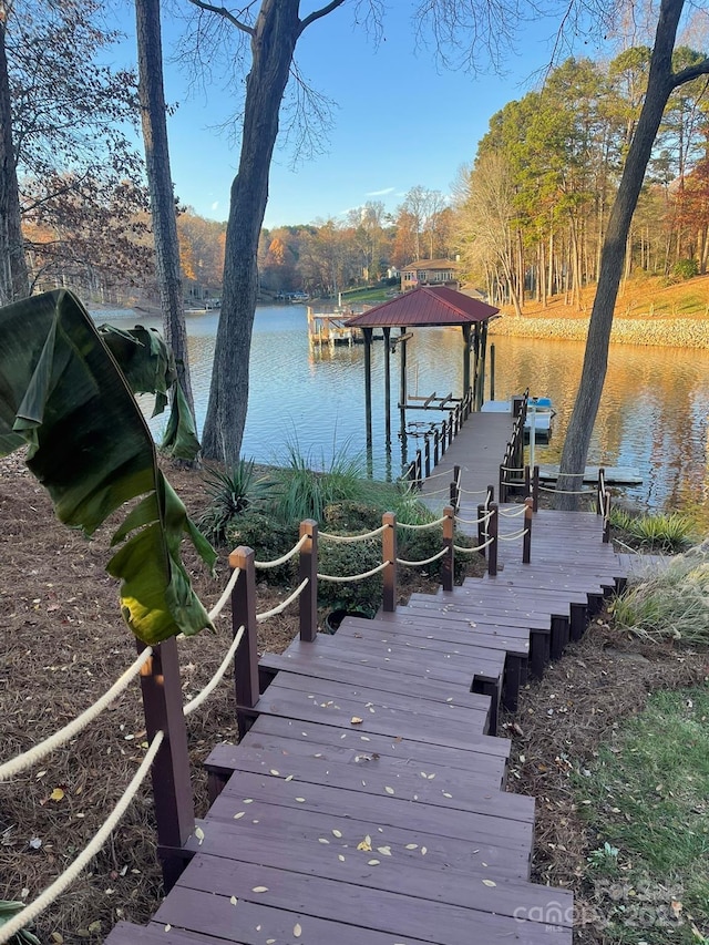 dock area featuring a water view and boat lift