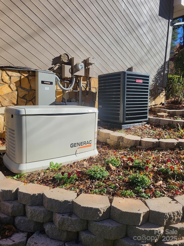 exterior details featuring electric meter, a power unit, and central AC unit