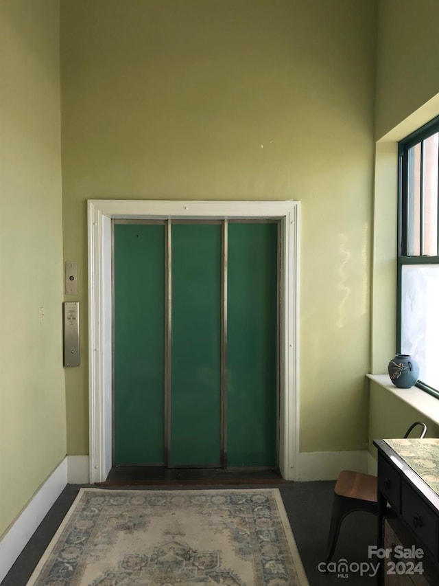 entryway featuring a towering ceiling