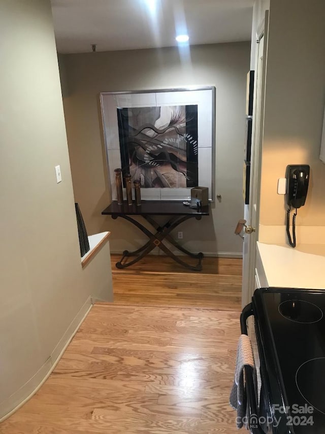 corridor featuring light hardwood / wood-style floors