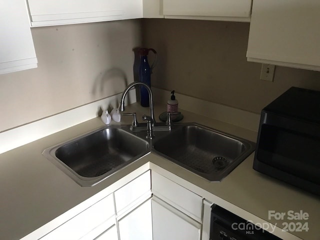 kitchen with white cabinets, sink, and stainless steel appliances