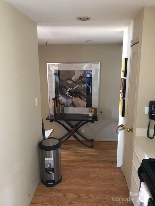 hallway featuring hardwood / wood-style flooring