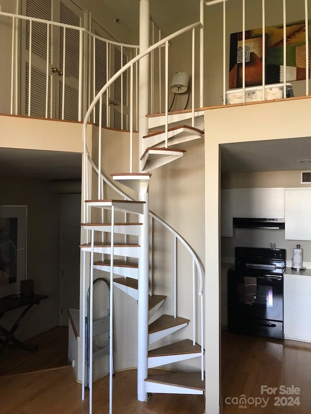 stairway with wood-type flooring