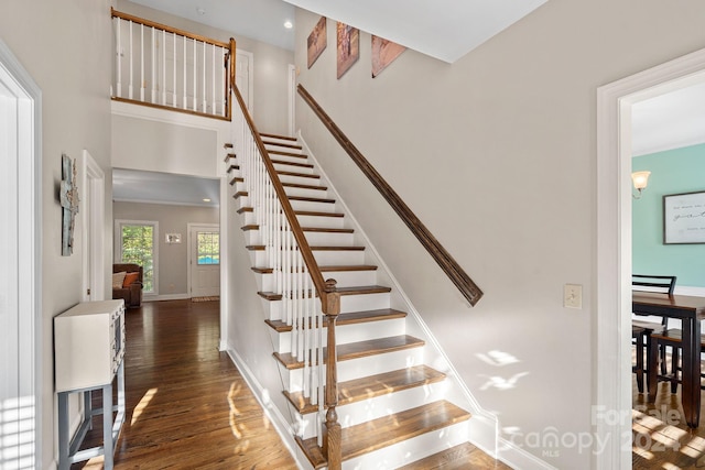 stairs featuring hardwood / wood-style floors