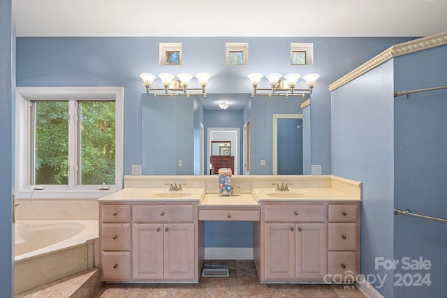 bathroom with a washtub and vanity