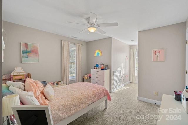 carpeted bedroom featuring ceiling fan