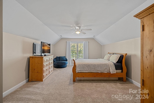 carpeted bedroom featuring ceiling fan and lofted ceiling