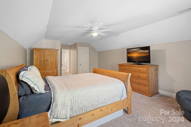 carpeted bedroom featuring ceiling fan, a closet, and lofted ceiling