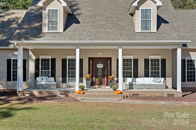 view of front facade with a front yard and a porch