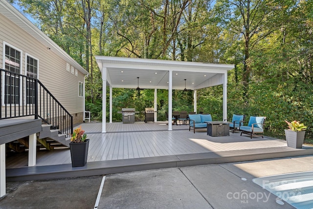 view of patio / terrace with area for grilling, a wooden deck, and an outdoor hangout area