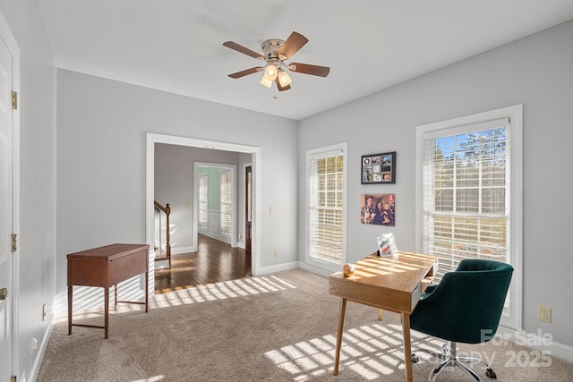 office with carpet flooring and ceiling fan