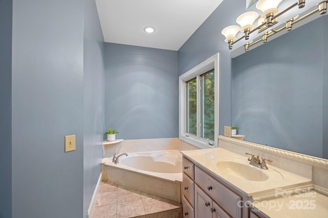 bathroom featuring vanity, a bath, tile patterned floors, and an inviting chandelier