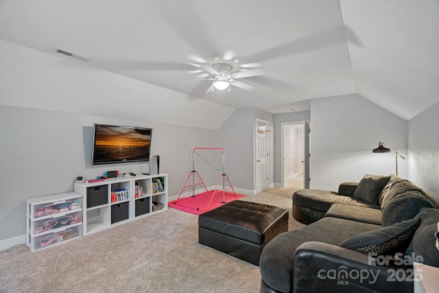 living room with ceiling fan, lofted ceiling, and carpet floors