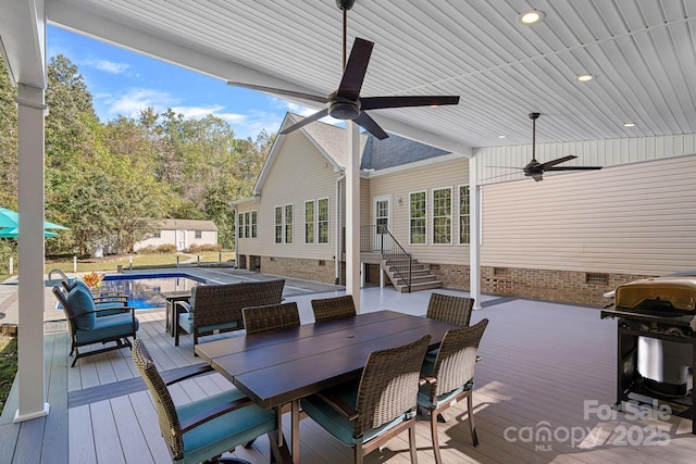 deck with ceiling fan, outdoor lounge area, and area for grilling