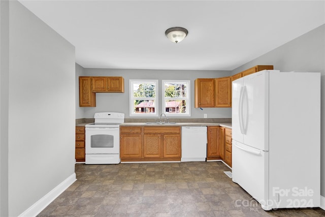 kitchen with white appliances and sink