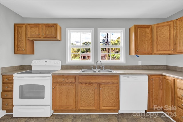 kitchen featuring sink and white appliances