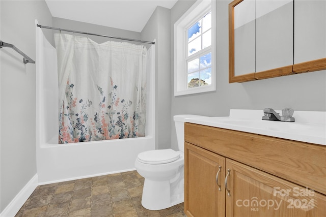 full bathroom featuring toilet, vanity, and shower / tub combo