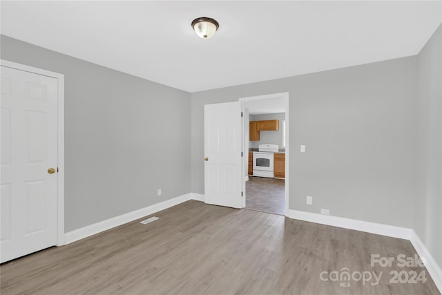 empty room with light hardwood / wood-style floors