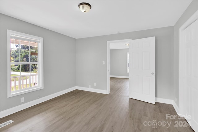 spare room featuring hardwood / wood-style flooring