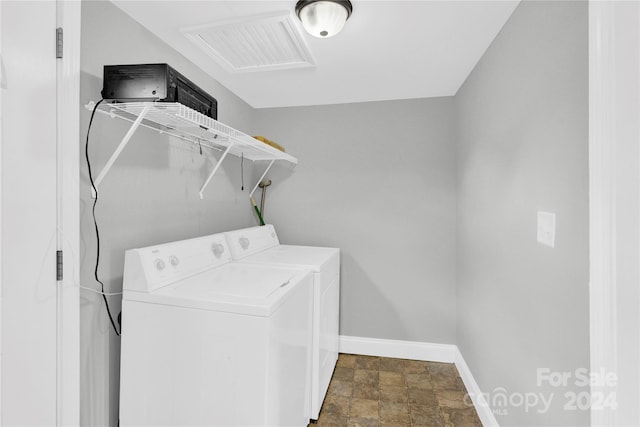 washroom featuring washer and clothes dryer