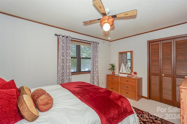 bedroom featuring crown molding, a textured ceiling, and ceiling fan