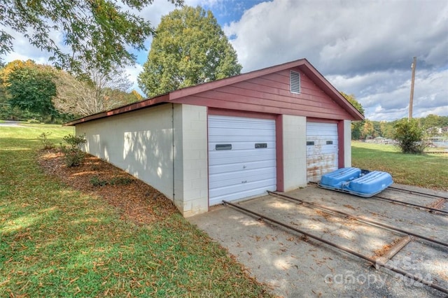 garage with a lawn