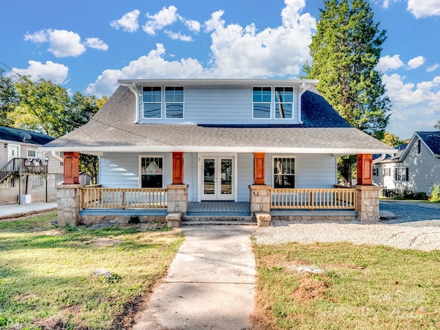 view of front of house featuring covered porch and a front lawn