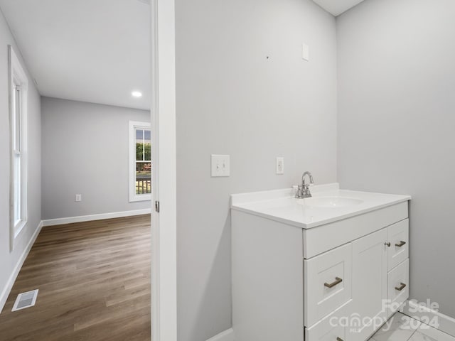 bathroom featuring vanity and hardwood / wood-style floors