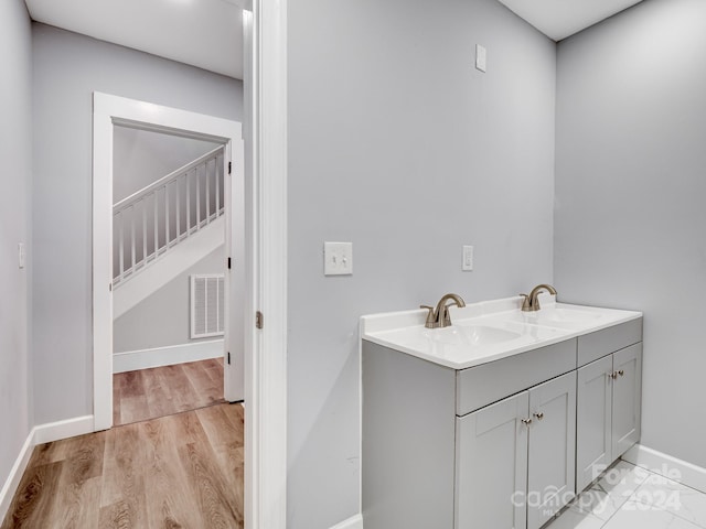 bathroom featuring vanity and wood-type flooring