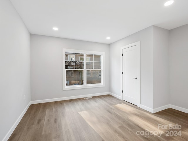 unfurnished room featuring light wood-type flooring