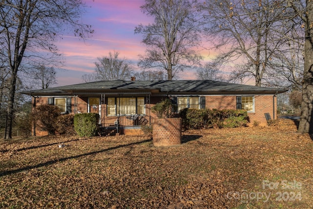 ranch-style home with a porch