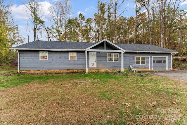 single story home featuring a front lawn and a garage