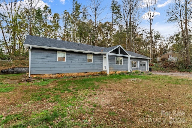 ranch-style home with a front lawn