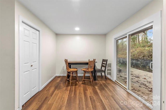 dining room with dark hardwood / wood-style flooring