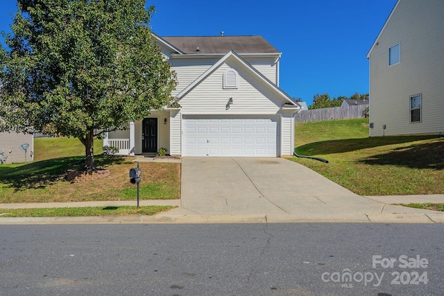 view of front facade with a garage and a front yard