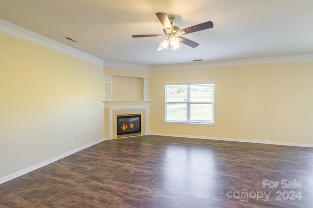 unfurnished living room featuring ceiling fan, crown molding, and dark hardwood / wood-style flooring