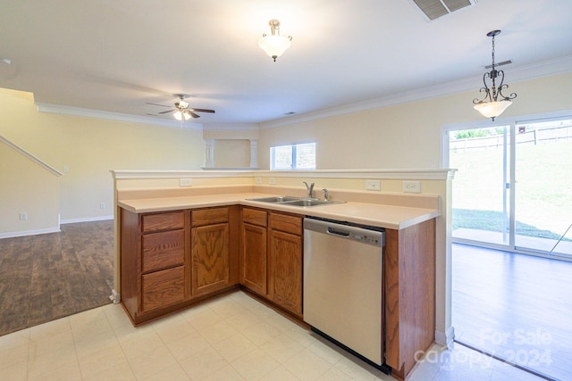 kitchen featuring dishwasher, a wealth of natural light, sink, and decorative light fixtures