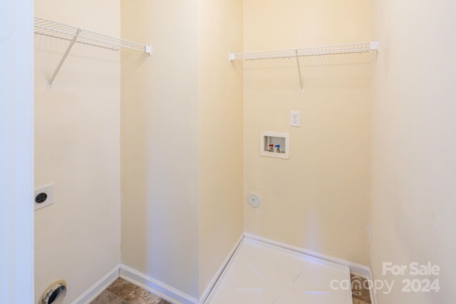 laundry area with hookup for a washing machine and hookup for an electric dryer